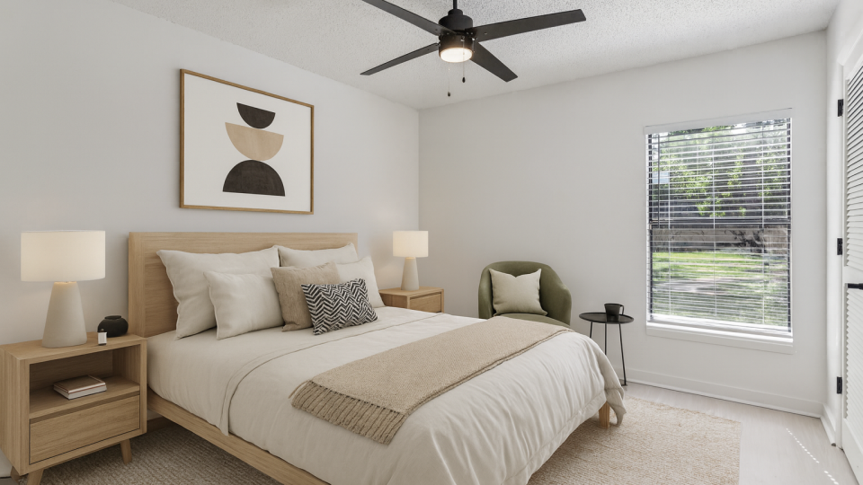 a bedroom with a ceiling fan and white bed at The Vista Bay